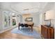 Elegant dining room with shuttered windows, chandelier, and classic hardwood floors at 7529 Tynewind Dr, Wake Forest, NC 27587