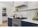 Well-equipped kitchen with stainless steel range, custom cabinets, and walk-in pantry at 7529 Tynewind Dr, Wake Forest, NC 27587