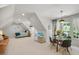 Open living space with bed, dining area with glass table, couch, and ample natural light at 7529 Tynewind Dr, Wake Forest, NC 27587