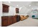 Living area features a stylish bar area, comfortable seating, and a glimpse of the bedroom at 7529 Tynewind Dr, Wake Forest, NC 27587