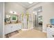 Large main bathroom with shower, bathtub, vanity and tile floor at 7529 Tynewind Dr, Wake Forest, NC 27587