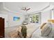 Comfortable primary bedroom with tray ceiling, ceiling fan, television and large windows at 7529 Tynewind Dr, Wake Forest, NC 27587