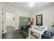 Convenient mud room with slate tile flooring, built-in bench, and storage at 7529 Tynewind Dr, Wake Forest, NC 27587