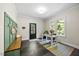Bright home office featuring a large window, workspace, and slate tile flooring at 7529 Tynewind Dr, Wake Forest, NC 27587