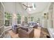 Bright sunroom with vaulted ceilings, skylights, and large windows offering beautiful views at 7529 Tynewind Dr, Wake Forest, NC 27587