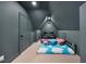 Theater room with a pair of chairs, cloud blanket, carpeted floor, and gray walls at 7529 Tynewind Dr, Wake Forest, NC 27587