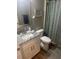 Bathroom featuring granite countertop, vanity, and framed mirror at 8 Open View Ln, Timberlake, NC 27583