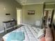 Spacious bedroom features a large bed with white comforter and gray walls at 8 Open View Ln, Timberlake, NC 27583