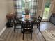 Dining room with a round table, comfortable chairs, and a view of the outdoors at 8 Open View Ln, Timberlake, NC 27583