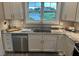 Kitchen featuring stainless steel appliances, granite countertops, and white cabinets at 8 Open View Ln, Timberlake, NC 27583