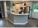 Open-concept kitchen featuring granite countertops, white cabinets, and stainless steel appliances at 8 Open View Ln, Timberlake, NC 27583