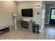 Cozy living room features a fireplace, TV, and modern decor at 8 Open View Ln, Timberlake, NC 27583