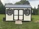Well-maintained shed with black trim and window boxes in backyard at 8 Open View Ln, Timberlake, NC 27583