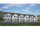A row of newly constructed townhomes shows exterior elevation with stone and neutral siding at 808 Old Tarboro Rd, Wendell, NC 27591