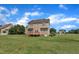 Two story home with a backyard that features a well-maintained lawn, and small wooden deck at 86 Woodall Farm Ln, Princeton, NC 27569
