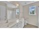 Bright bathroom featuring a double sink vanity, toilet, and a shower/tub combination at 86 Woodall Farm Ln, Princeton, NC 27569