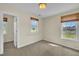 Bright bedroom featuring two large windows, neutral carpet, and a simple overhead light fixture at 86 Woodall Farm Ln, Princeton, NC 27569