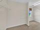 Large walk-in closet with wire shelving and a window offering natural light at 86 Woodall Farm Ln, Princeton, NC 27569