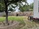 Well-maintained backyard with lush grass, mature trees, and a privacy fence, offering a serene outdoor space at 917 Widewaters Pkwy, Knightdale, NC 27545