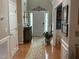 Traditional foyer featuring hardwood floors, a decorative mirror, and elegant accents at 917 Widewaters Pkwy, Knightdale, NC 27545