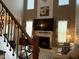 Open floorplan living room with fireplace and a decorative mantel at 917 Widewaters Pkwy, Knightdale, NC 27545