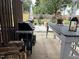 Spacious outdoor patio with a grill, dining table, and comfortable seating, perfect for gatherings at 917 Widewaters Pkwy, Knightdale, NC 27545