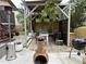 Inviting outdoor patio area with a grill, dining area, and charming decor, ready for relaxation at 917 Widewaters Pkwy, Knightdale, NC 27545
