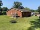 The spacious backyard features a playhouse, offering plenty of room for outdoor activities and Gathering enjoyment at 1021 Delray St, Durham, NC 27713