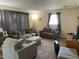 The living room offers plush seating, soft lighting, and a welcoming ambiance for relaxing and entertaining guests at 1021 Delray St, Durham, NC 27713