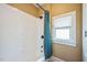 Bathroom with white shower, toilet, window and painted walls at 1213 Pierce St, Raleigh, NC 27605