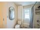 Bathroom with toilet, mirror, and shower at 1213 Pierce St, Raleigh, NC 27605