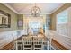 Cozy dining room with view into the bright, updated kitchen at 1213 Pierce St, Raleigh, NC 27605