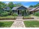 Charming single-story home with stone walkway and inviting curb appeal at 1213 Pierce St, Raleigh, NC 27605