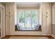 Comfortable window seat in the living room featuring built-in storage at 1213 Pierce St, Raleigh, NC 27605