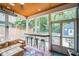 Relaxing screened-in porch featuring ample seating and natural light at 1213 Pierce St, Raleigh, NC 27605