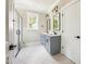 Stylish bathroom with double sink vanity and glass shower at 150 Purslane Dr, Franklinton, NC 27525