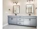 Bathroom featuring double vanity, white countertops, grey cabinets, and modern fixtures at 150 Purslane Dr, Franklinton, NC 27525