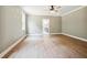 Spacious bedroom with modern ceiling fan and view of the bathroom at 150 Purslane Dr, Franklinton, NC 27525