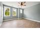 Bedroom features wood floors, neutral colored walls, and two large windows at 150 Purslane Dr, Franklinton, NC 27525
