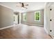 Large bedroom with ceiling fan, modern window trim, and hardwood floors at 150 Purslane Dr, Franklinton, NC 27525