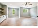 Spacious bonus room features wood floors, cabinets, two windows, and a ceiling fan at 150 Purslane Dr, Franklinton, NC 27525