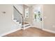Entryway with hardwood floors, white trim and a staircase with metal balusters at 150 Purslane Dr, Franklinton, NC 27525