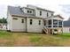 Rear view of the house showing the screened porch and light green siding at 150 Purslane Dr, Franklinton, NC 27525