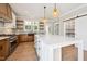 Well-appointed kitchen with a large island, floating shelves, and stainless appliances at 150 Purslane Dr, Franklinton, NC 27525