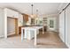 Bright kitchen with large island, stainless appliances, and a sliding barn door at 150 Purslane Dr, Franklinton, NC 27525