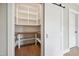 Walk-in pantry with custom shelving, wood countertop and sliding barn door at 150 Purslane Dr, Franklinton, NC 27525