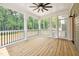 Screened in porch with ceiling fan and wooden floor at 150 Purslane Dr, Franklinton, NC 27525