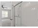 Bathroom with glass door shower, white subway tile, marble flooring, and bedroom view at 1505 Poets Glade Dr, Apex, NC 27523