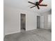 This bedroom features carpet, neutral walls, two entry doors and a ceiling fan at 1505 Poets Glade Dr, Apex, NC 27523