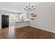 Open kitchen with stainless appliances, quartz countertops, and breakfast bar at 1505 Poets Glade Dr, Apex, NC 27523